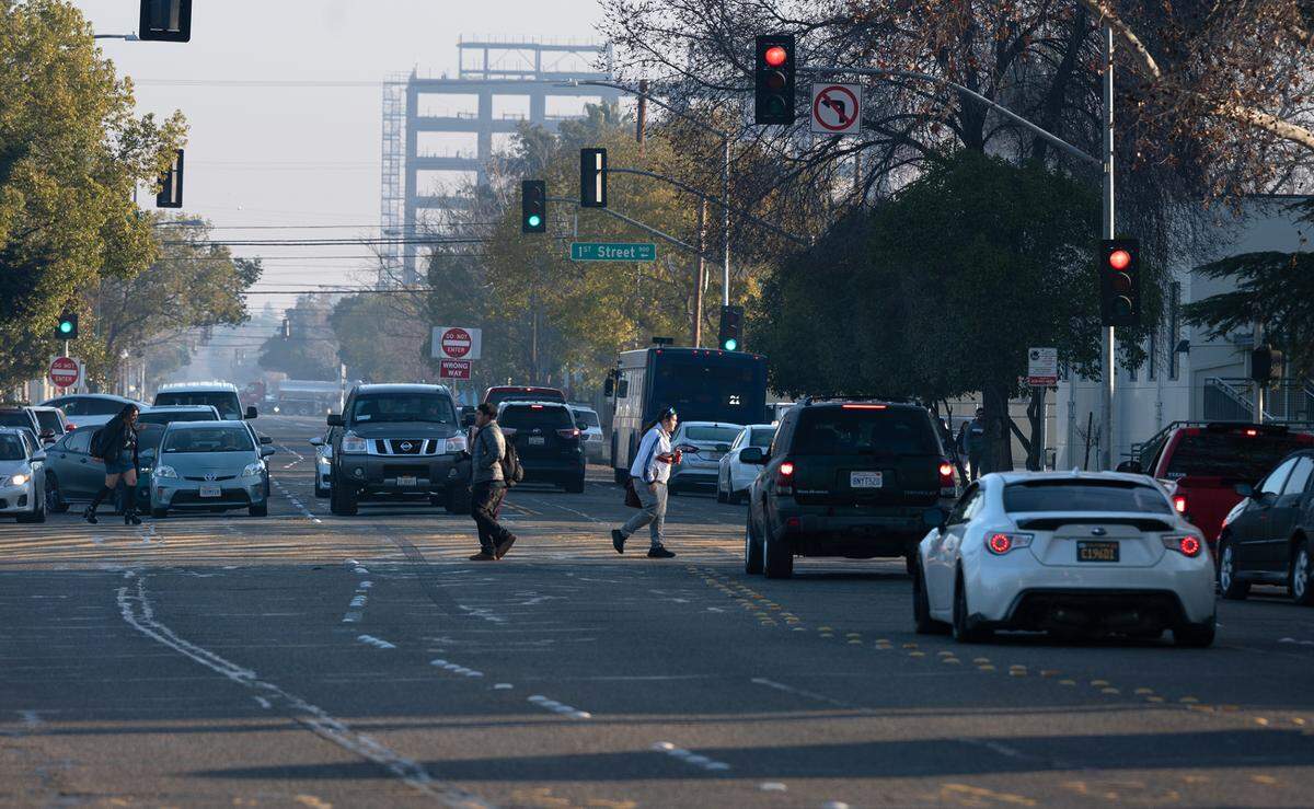 Modesto High School students cross Paradise Road in Modesto, Calif., Thursday, Jan. 26, 2023.