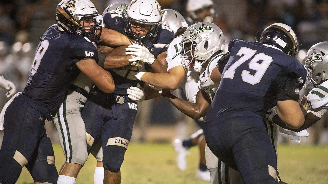 Central Catholic’s Minaya Olivo runs the ball during the non-league game with De La Salle at Central Catholic High School in Modesto, Calif., Aug. 30, 2019.