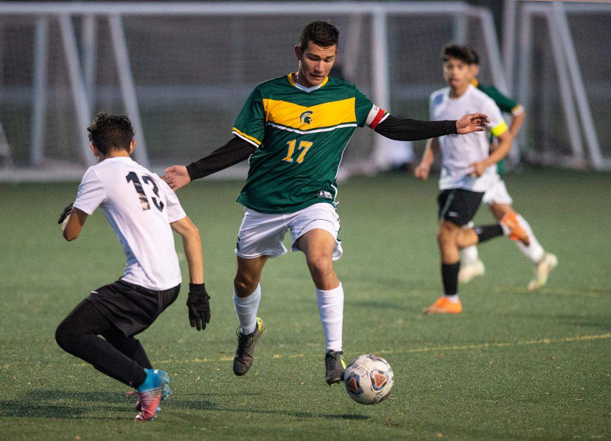 Davis High’s Erik Lomeli controls the ball during a Western Athletic Conference game with Lathrop High at Mary Grogan Park in Modesto, Calif., Friday, Dec. 16, 2022.