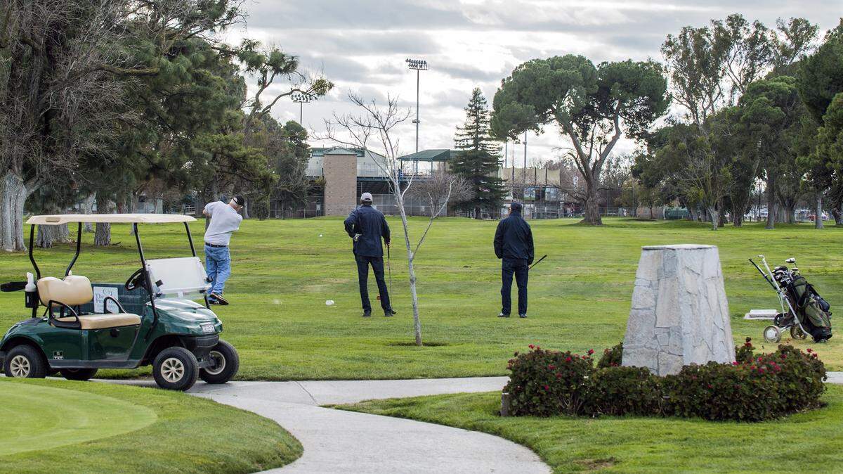 A group of three tee off near the clubhouse at Modesto Municipal Golf Course on Jan. 13, 2020, in Modesto, California. City officials could decide Tuesday to close and prepare for the sale of Modesto Municipal Golf Course, where generations have learned to play since the nine-hole course opened in the 1930s.