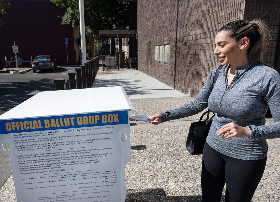 Shanette Meadows of Modesto drops her recall election ballot at the Stanislaus County Registrar of Voters office in Modesto, Calif., on Tuesday, Sept. 14, 2021.