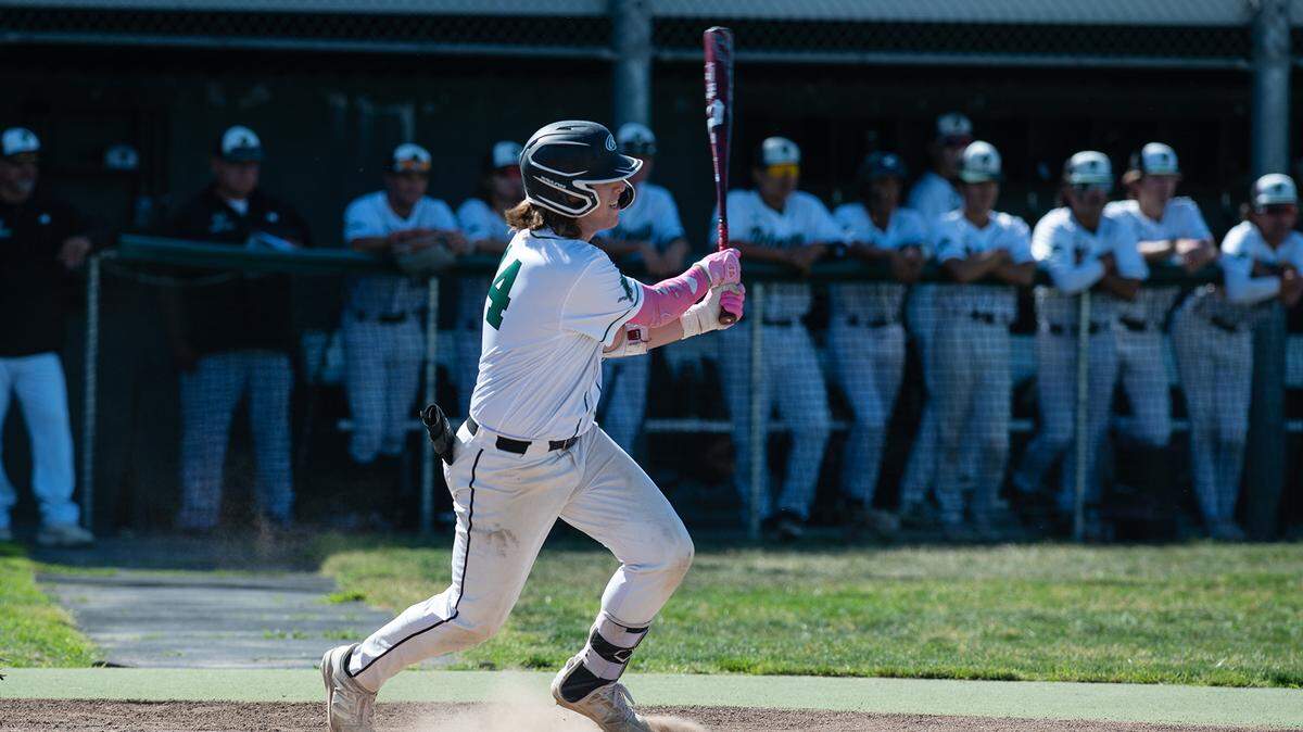 Pitman’s Andrew Balentine connects for a base hit during the Division 2 Sac-Joaquin Section Baseball Playoff game with Rio Americano (Sacramento) at Pitman High School in Turlock, Calif., on Thursday, May 12, 2022. Rio won the game 7-1.