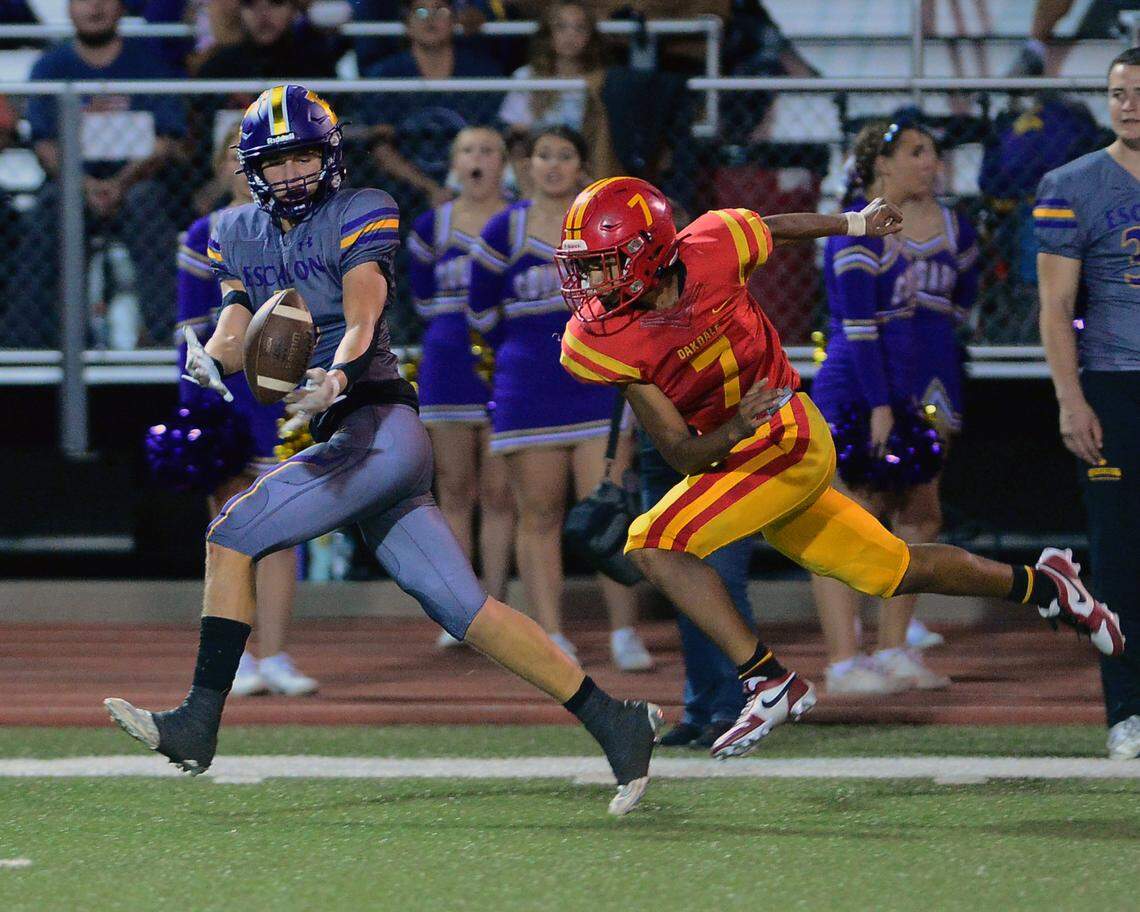 A pass intended for Sam Jimenez (5) falls incomplete during a game between Oakdale and Escalon at Oakdale High School in Oakdale, California, on September 15, 2023.