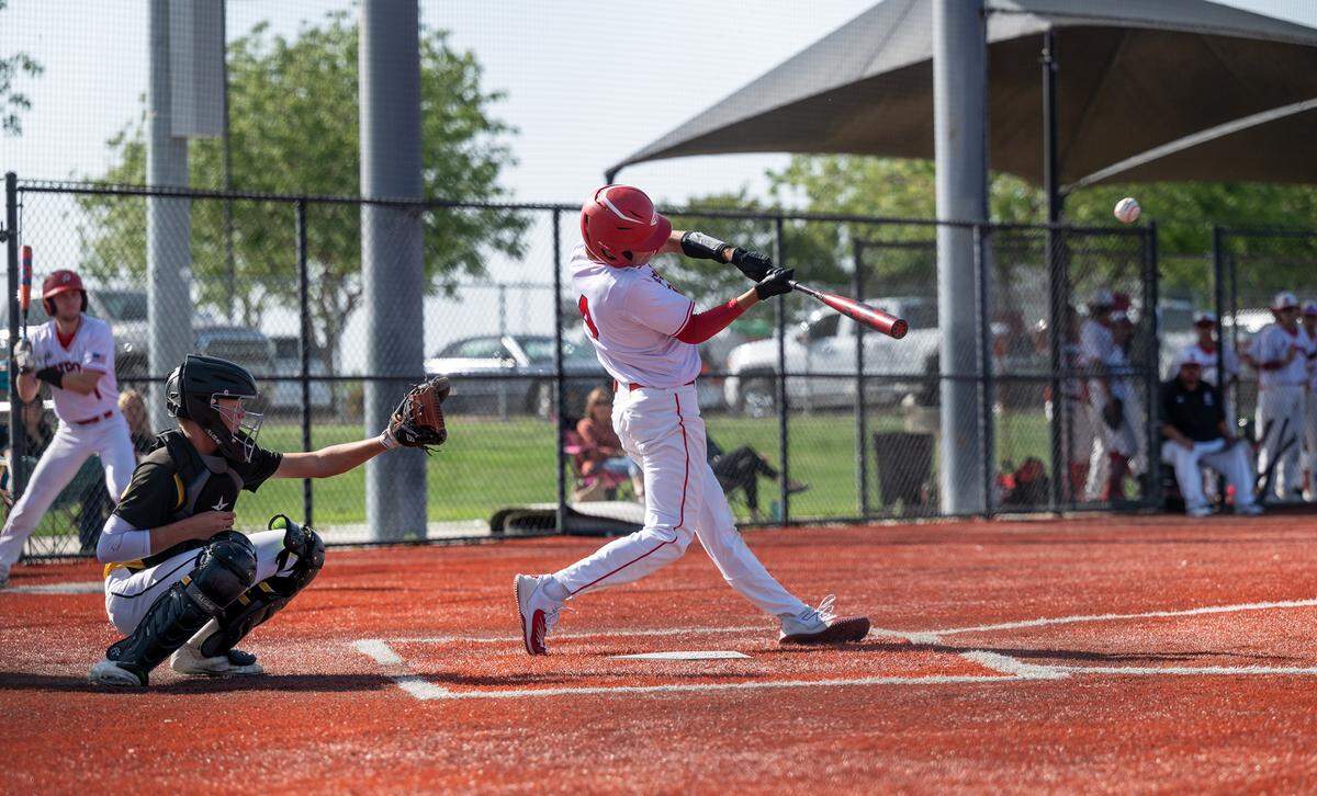 Ripon’s Korbin Hodgson connects for a triple during the Trans Valley League game with Hughson at Mistlin Park in Ripon, Calif., on Wednesday, April 27, 2022. Ripon won the game 11-1.