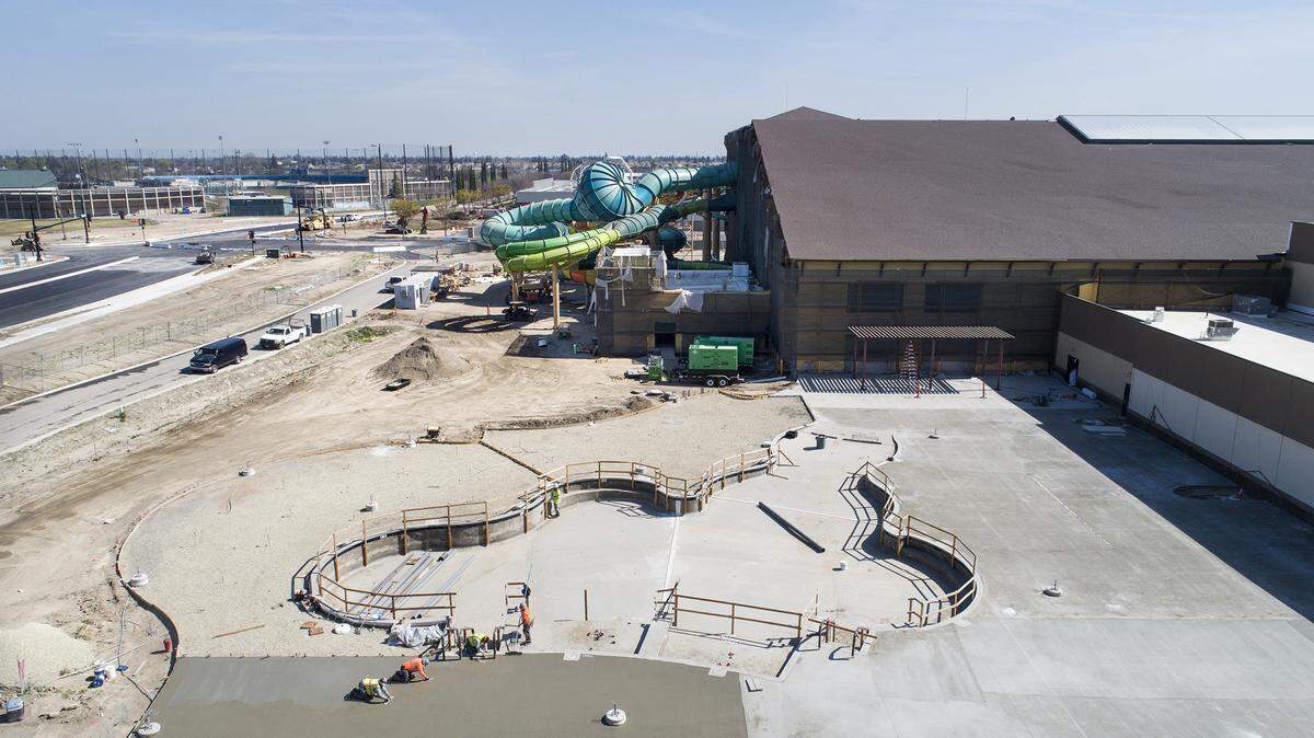 Workers level concrete at the outdoor pool at the Great Wolf Lodge in Manteca, Calif., on Wednesday, March. 4, 2020.