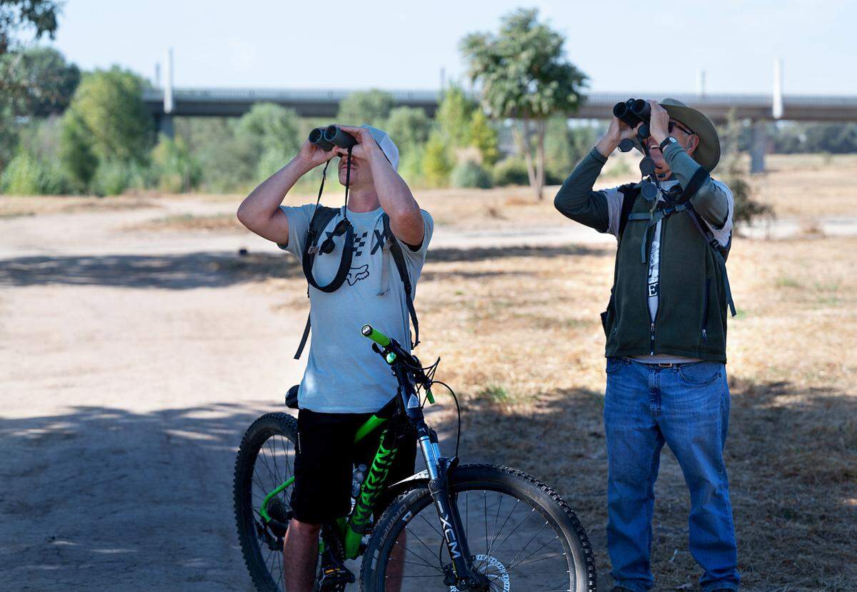Gusty Souza, left, and Daniel Gilman from Stanislaus Audubon Society look at birds during Modesto RecFest at Gateway Park in Modesto, Calif., Saturday, Oct. 21, 2023.