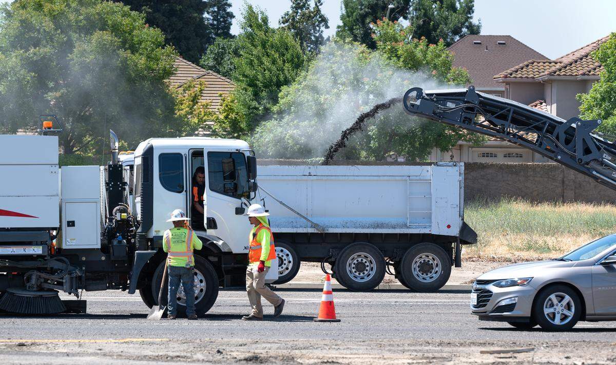 Roadway resurfacing will cause traffic to be reduced to one lane on Briggsmore Avenue in Modesto, Calif., Wednesday, June 21, 2023. The resurfacing project should take two days.