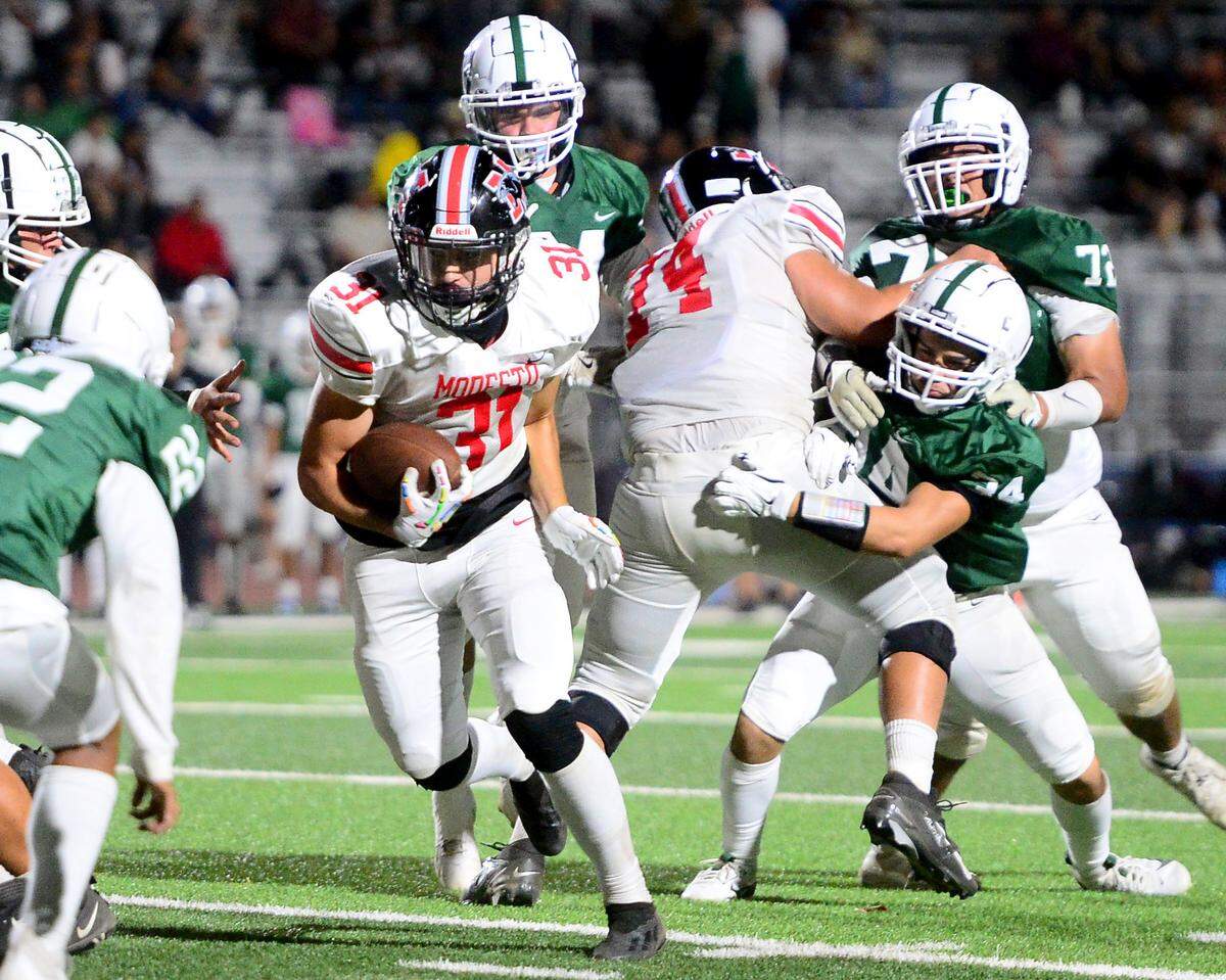 Modesto High running back Jaden Rivera (31) charges ahead during a game between Modesto High School and Central Valley High School at Gregori High School in Modesto, California on September 13, 2024.