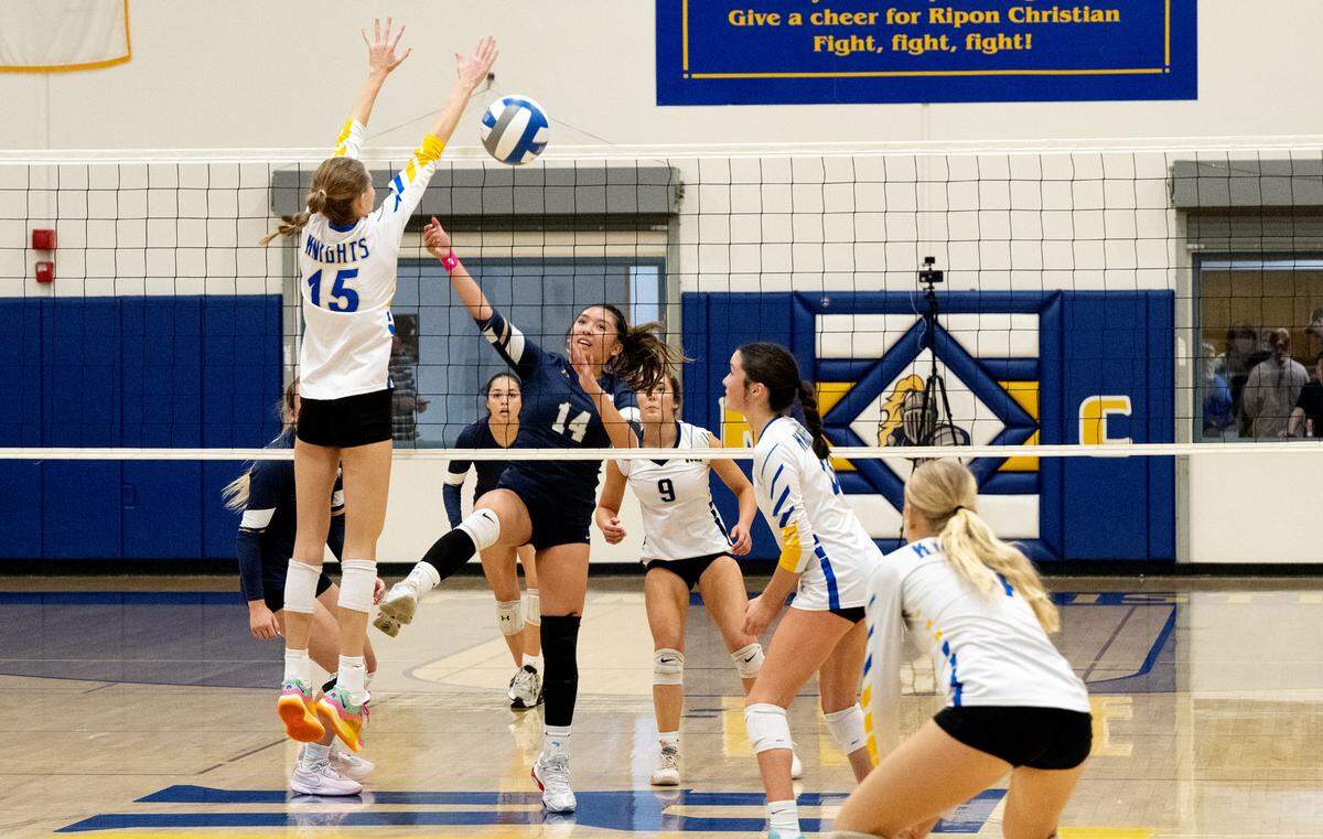 Central Catholic’s Czyleah Pabustan spikes the ball past Ripon Christian’s Haley Kootstra (15) during the Sac-Joaquin Section Division III quarterfinal playoff match at Ripon Christian High School in Ripon, Thursday, Oct. 31, 2024.