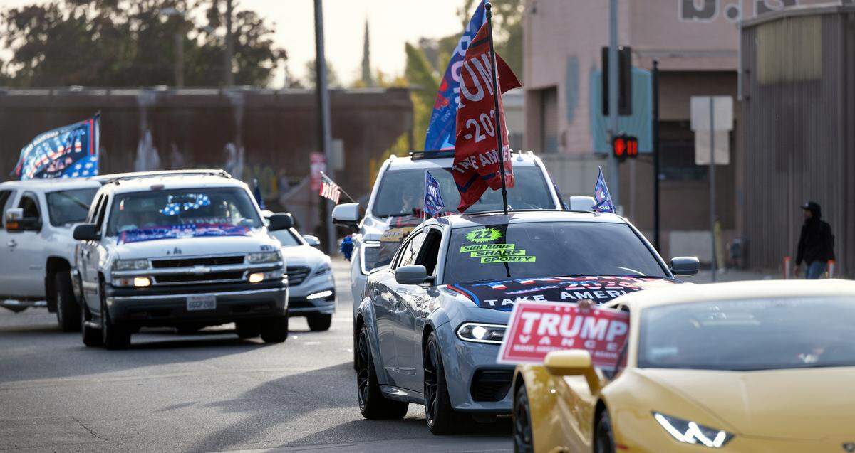 Trump supporters caravan down G Street in Modesto on Election Day, Tuesday, Nov. 5, 2024.