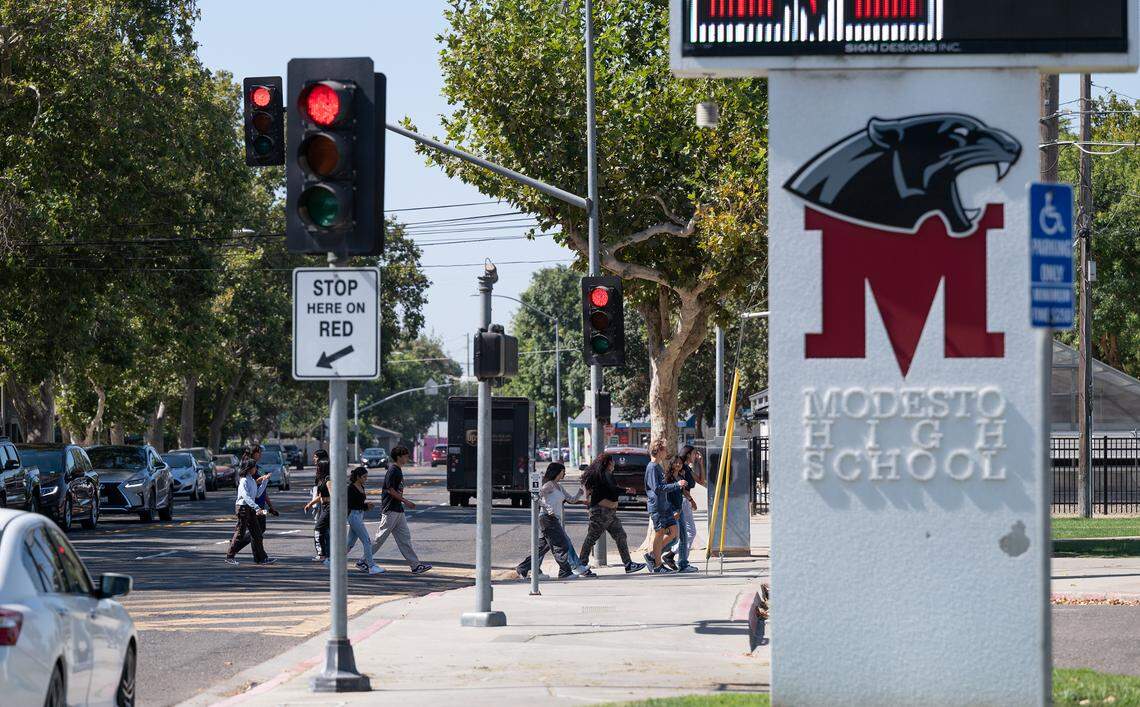 Modesto High School students cross H Street in Modesto, Calif., Wednesday, September 6, 2023.