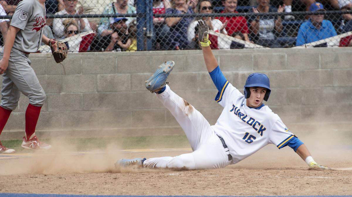 Turlock’s Tyler Soderstrom scores ahead of the throw during the Sac-Joaquin Section baseball playoff game with Lincoln at Turlock High School in Turlock, Calif., Tuesday, May 14, 2019.