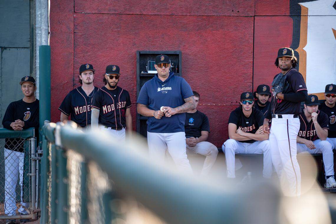 Modesto Nuts pitching coach Jake Witt watches as starting pitcher Christian Little warms up ahead of his final home start on Aug. 13, 2025. He was called up to the High-A Everett AquaSox on Aug. 20.