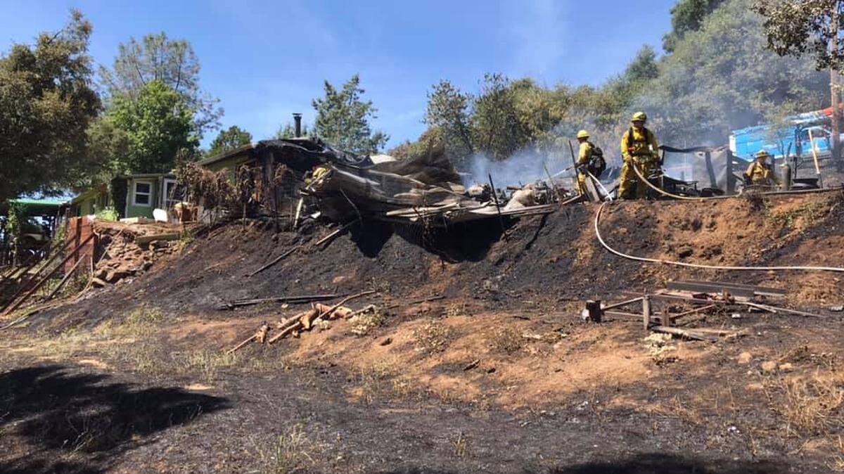 Firefighters battled a structure fire that spread to vegetation in Soulsbyville late Thursday morning and early afternoon.