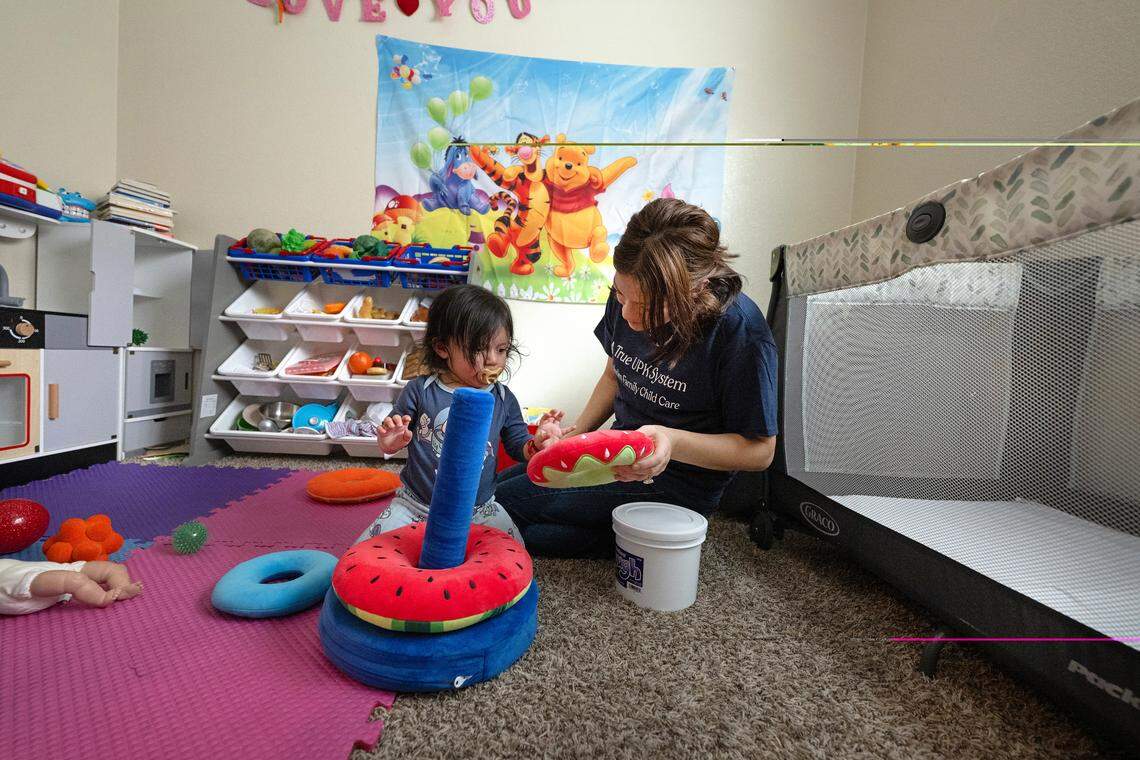 Childcare provider Adriana Segura works with Xander Cabello, 1, in Patterson, Friday, April 24, 2026.