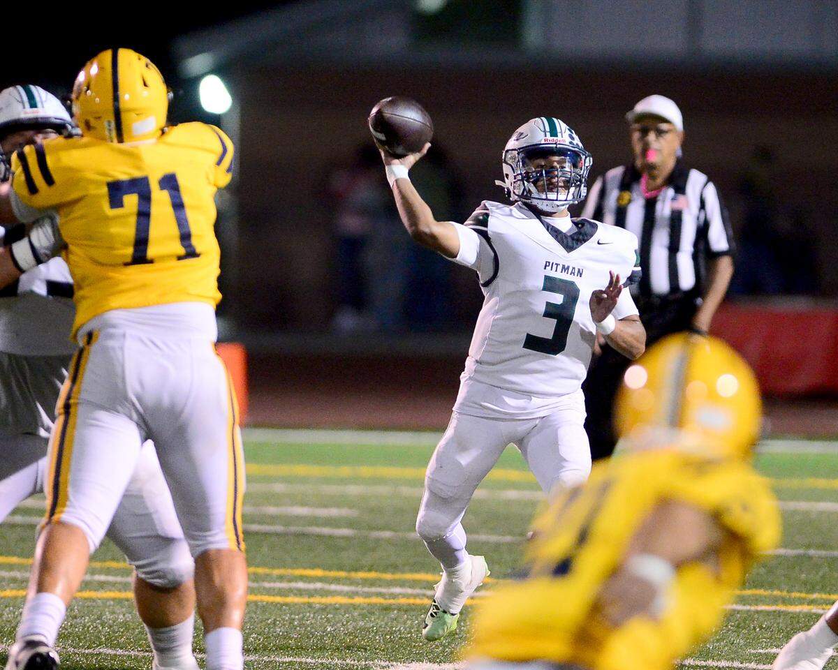 Pitman quarterback Rj Wilharm (3) throws a pass during the game with Turlock at Turlock High School in Turlock, Oct. 17, 2025.