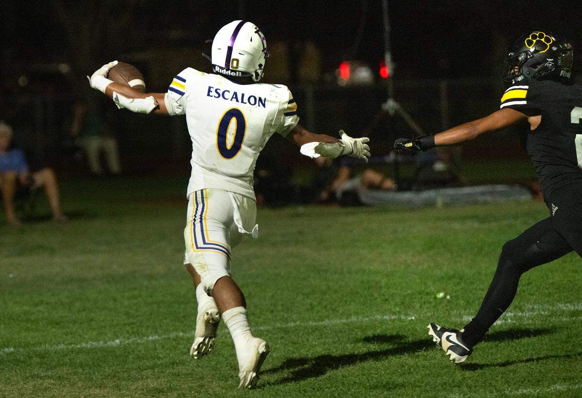 Escalon’s Ben Gonzalez scores a touchdown on a run during the Trans Valley League game with Hughson in Hughson, Calif., Friday, Oct. 4, 2024.