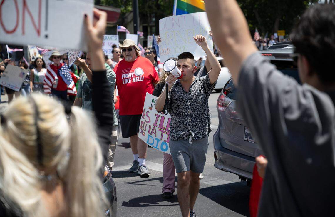 “No Kings” protestors rallied at Five Points to oppose Trump Administration policies at Graceada Park in Modesto, Saturday, June 14, 2025. 