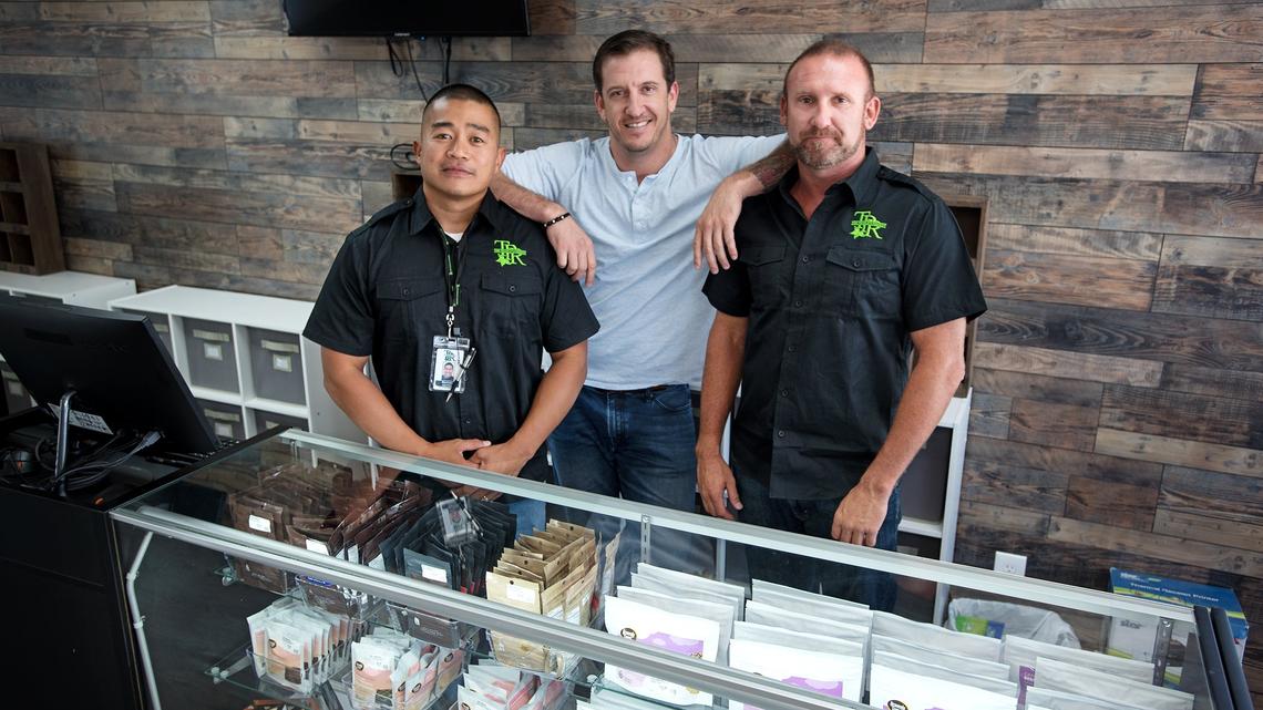 Business partners Marlowe Mercado, left, Mark Ponticelli, middle, and Dominic Truhett, right, at the The People’s Remedy marijuana dispensary in Oakdale, Calif., on Wednesday, September 5, 2018.
