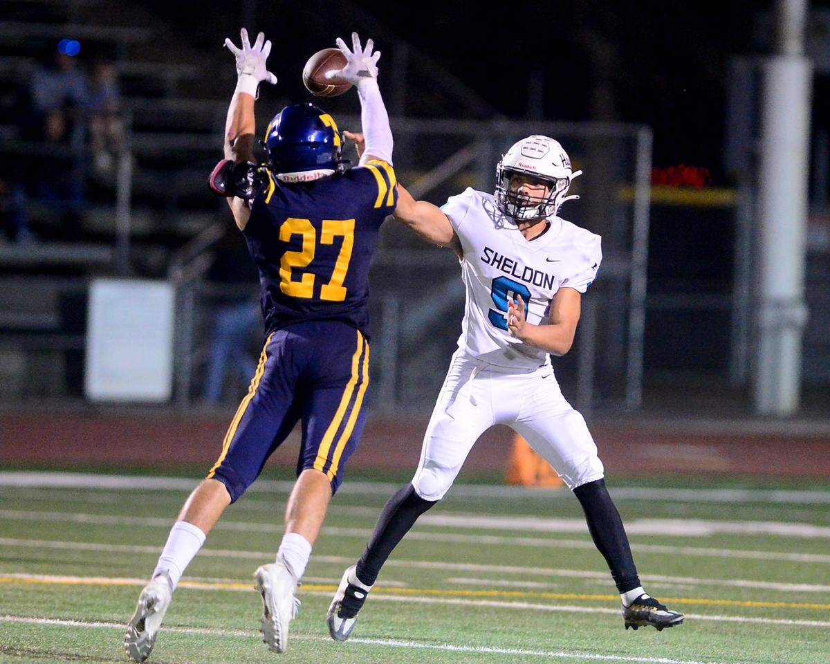Sheldon quarterback Malakai Savage’s (9) pass is broken up by Turlock defender Brady Green (27) during a CIF Sac-Joaquin Section Football Division I playoff game between Turlock High School and Sheldon High School at Turlock High School in Turlock, California on Nov. 3, 2023.