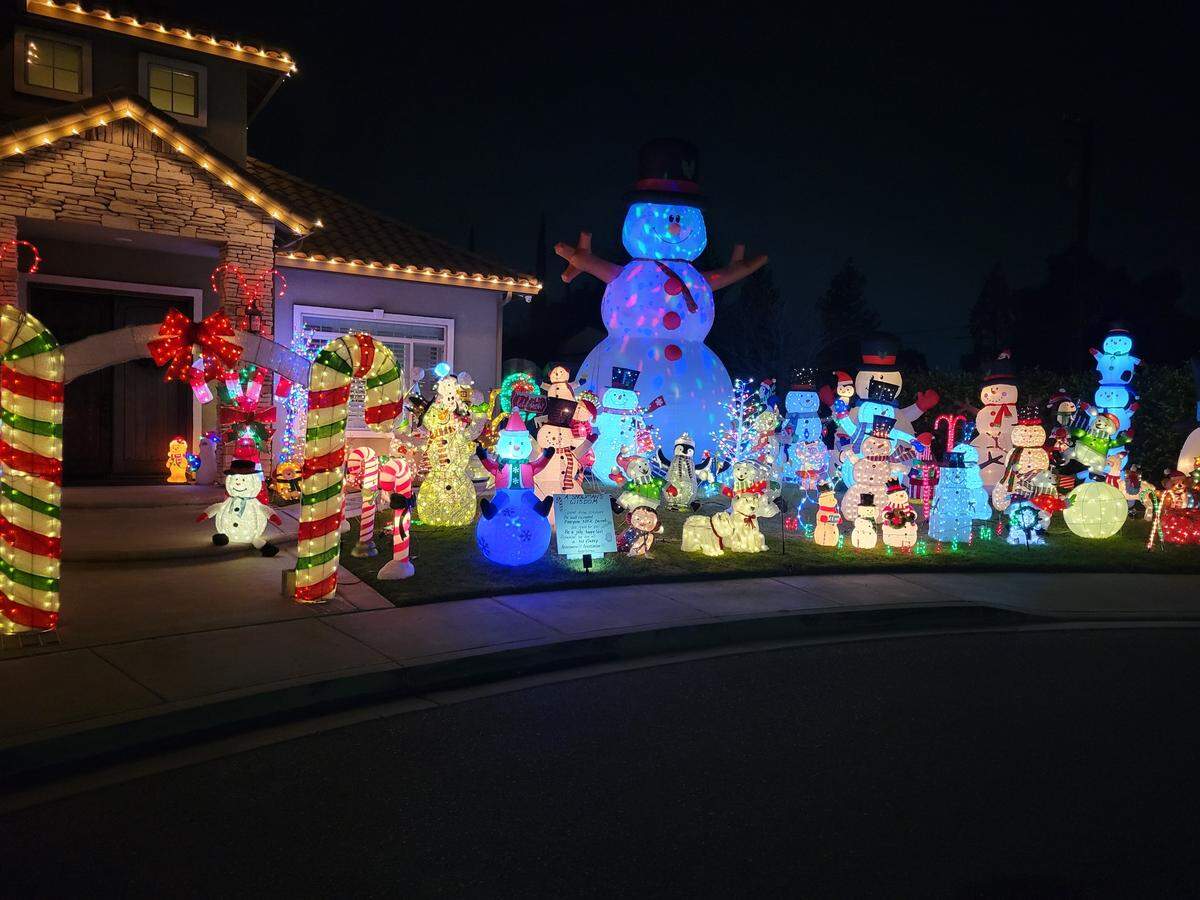 A house on Sarah Therese Way in Modesto has nearly 50 inflatable snowmen.