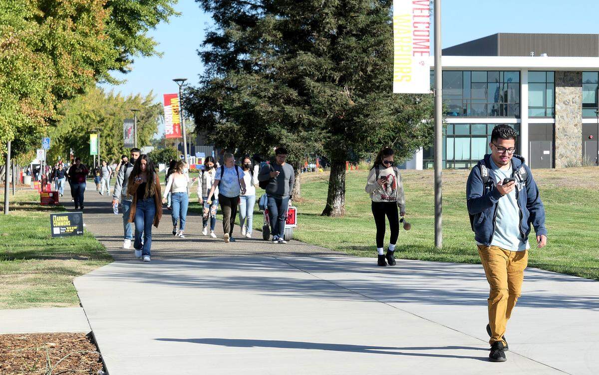 Students cross the Stanislaus State University campus in Turlock.