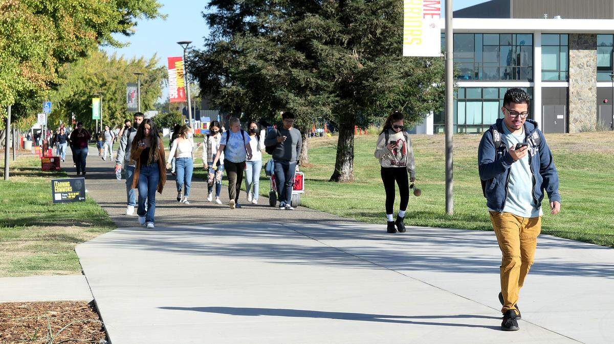 Students cross the Stanislaus State University campus in Turlock.
