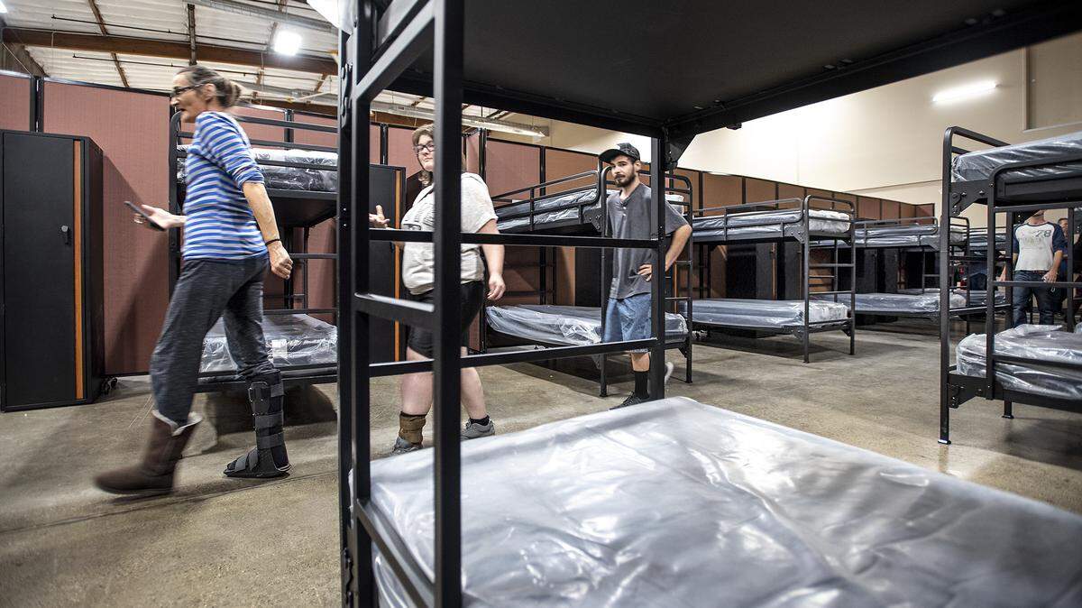 Community members tour the then-new Access Center Emergency Shelter at the Salvation Army’s Berberian facility on 9th Street in Modesto, Calif., Tuesday, Nov. 5, 2019. 