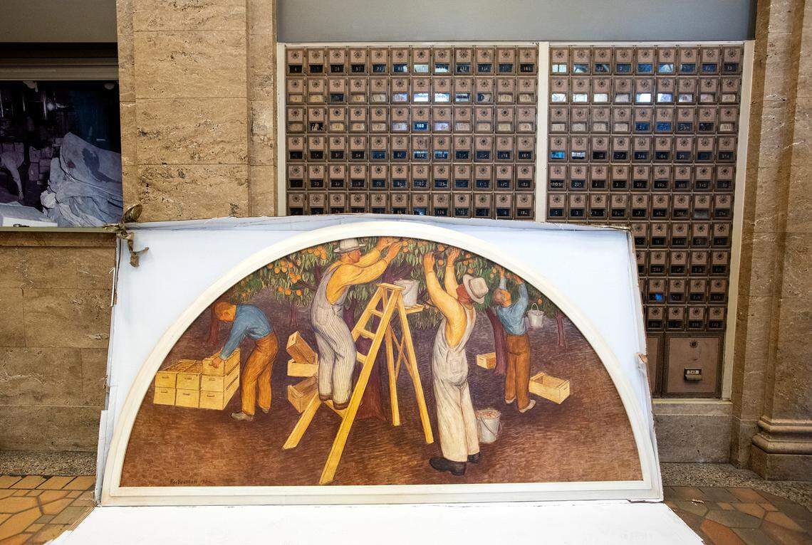 “Fruit Picking” by Ray Boynton was returned to the El Viejo Building, the former downtown Post Office, in Modesto, Calif., on Friday, July 22, 2022. The paintings had been removed during a remodel in 1967.