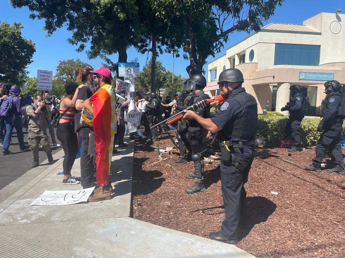 Modesto police move in after declaring an unlawful assembly during protests Saturday on McHenry Avenue. Aug. 27, 2022.