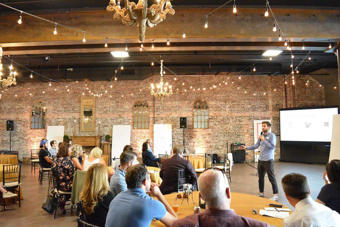 Thomas Both, Director of Designing for Social Systems at the Stanford d.school, addresses the room at Designing the Future of Stanislaus County on Sept. 27 at Greens on Tenth.