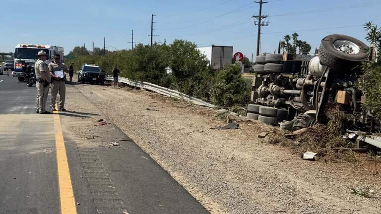 Overturned semi closes lane on southbound Highway 99 near Merced. Traffic delayed