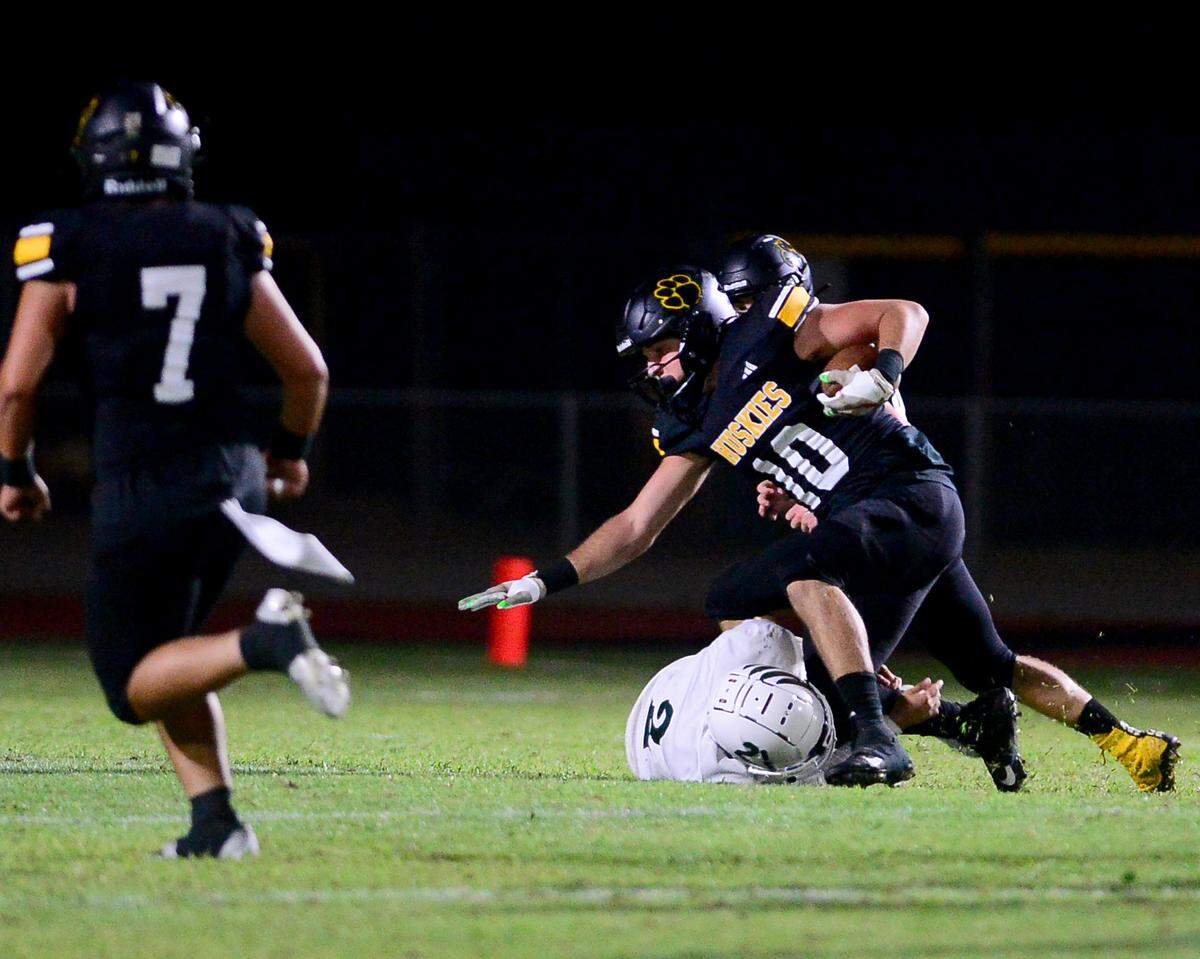 Hughsons Max Mankins gets tackled after an interception during a game between Hughson High School and Central Valley High School at Hughson High School in Hughson California on August 25, 2023.
