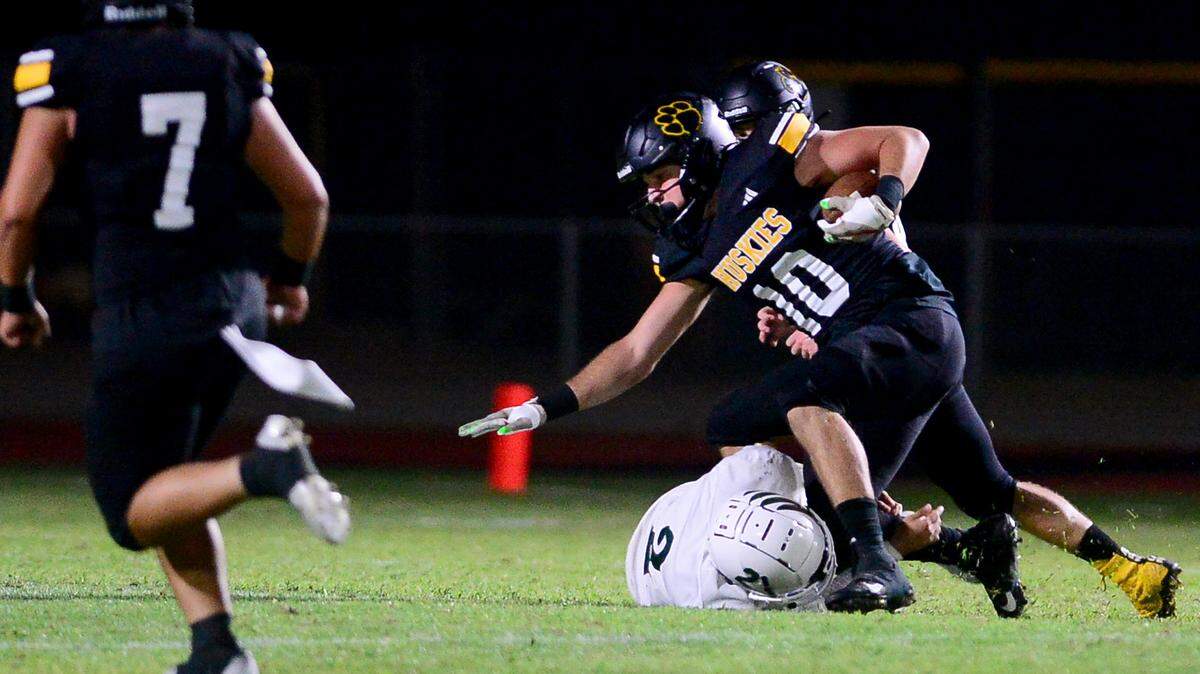 Hughsons Max Mankins gets tackled after an interception during a game between Hughson High School and Central Valley High School at Hughson High School in Hughson California on August 25, 2023.