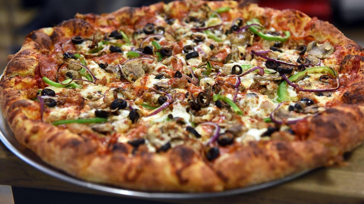 A fresh-made combo pizza made by a Stanislaus County pizza shop.