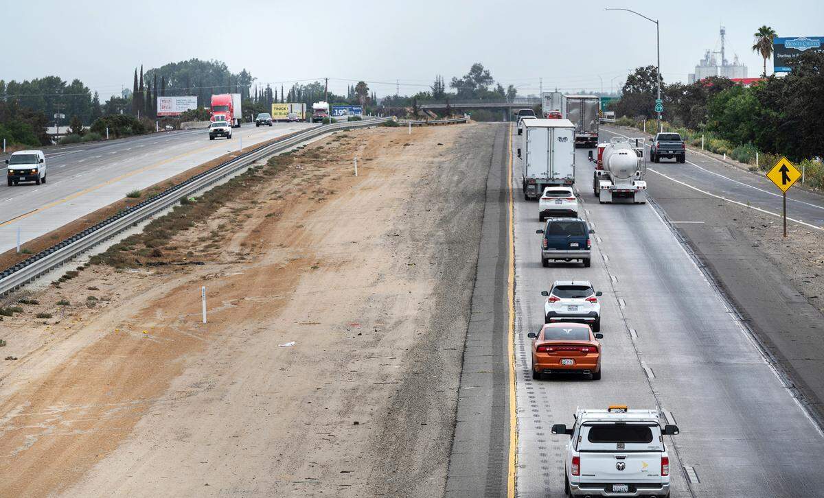 Motorists travel south along Highway 99 outside Delhi, Calif., on Friday, August 5, 2022.