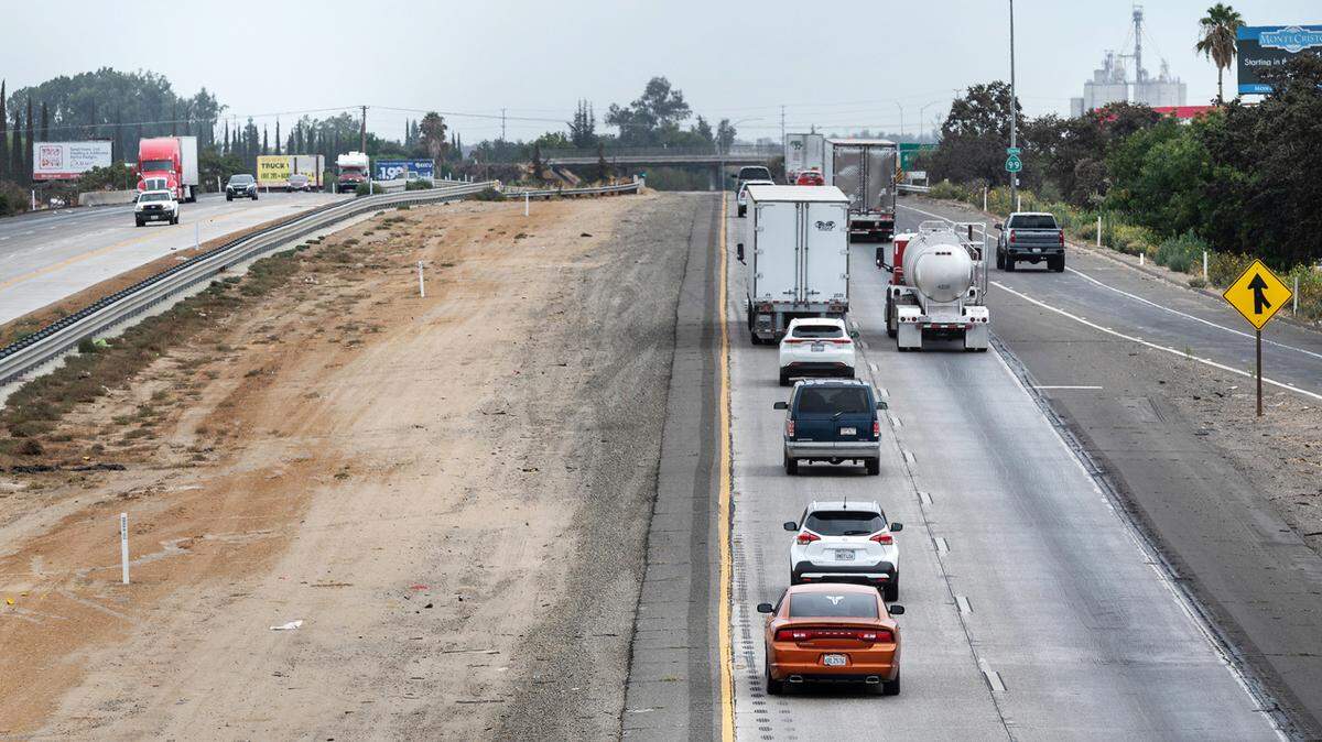 Motorists travel south along Highway 99 outside Delhi, Calif., on Friday, August 5, 2022. A widening project will add a third lane from the Stanislaus/Merced county line to Hammatt Avenue by fall 2023.
