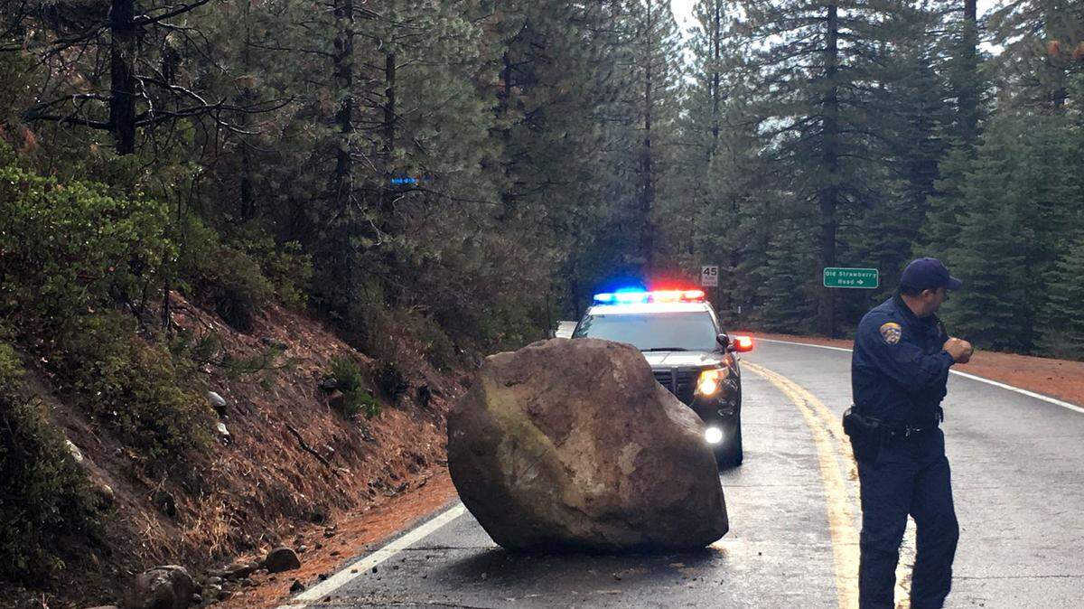 Pictured on Highway 108 in Strawberry, Calif. A hazard on rainy day Wednesday November 28, 2018 is this boulder that almost hit a passing motorist.