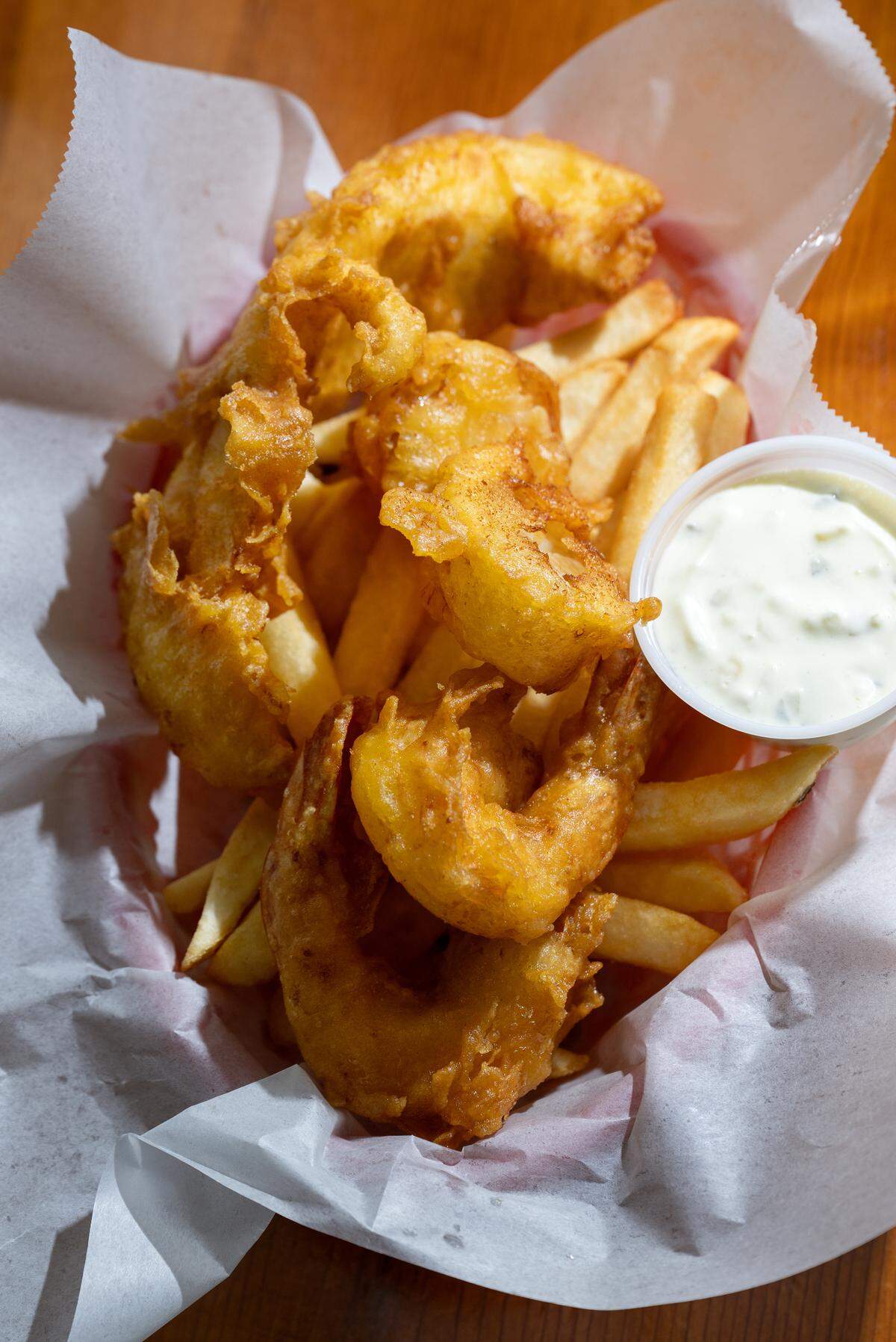 A fish combo basket (Alaskan cod, shrimp and scallops) at Ann’s Fish & Chips in Hughson, Thursday, April 17, 2025.