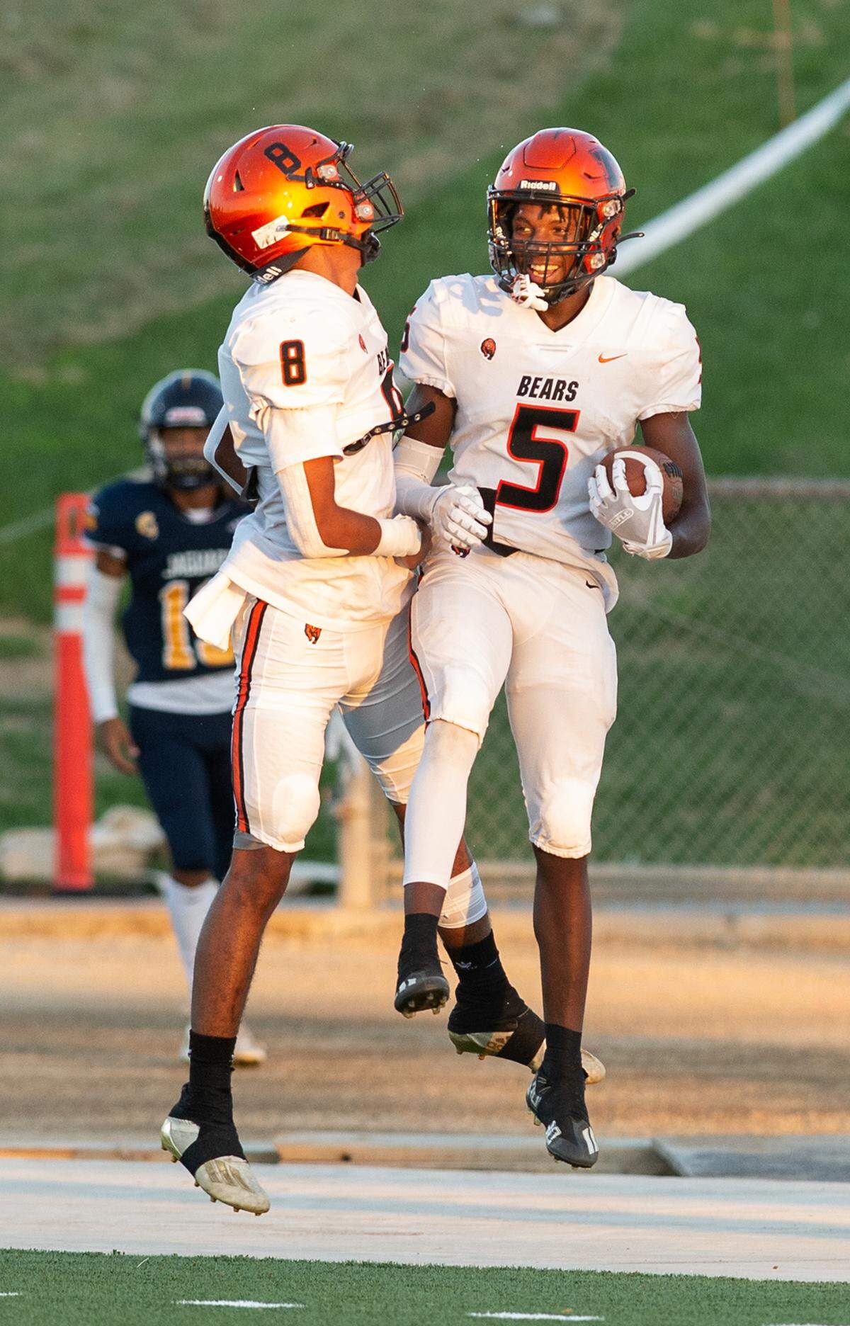 Merced’s Chase Smith (5) and Enoch Evans celebrate Smith’s touchdown run during the non-league game with Gregori at Gregori High School in Salida, Calif., on Friday, August 26, 2022. Merced won the game 33-14.