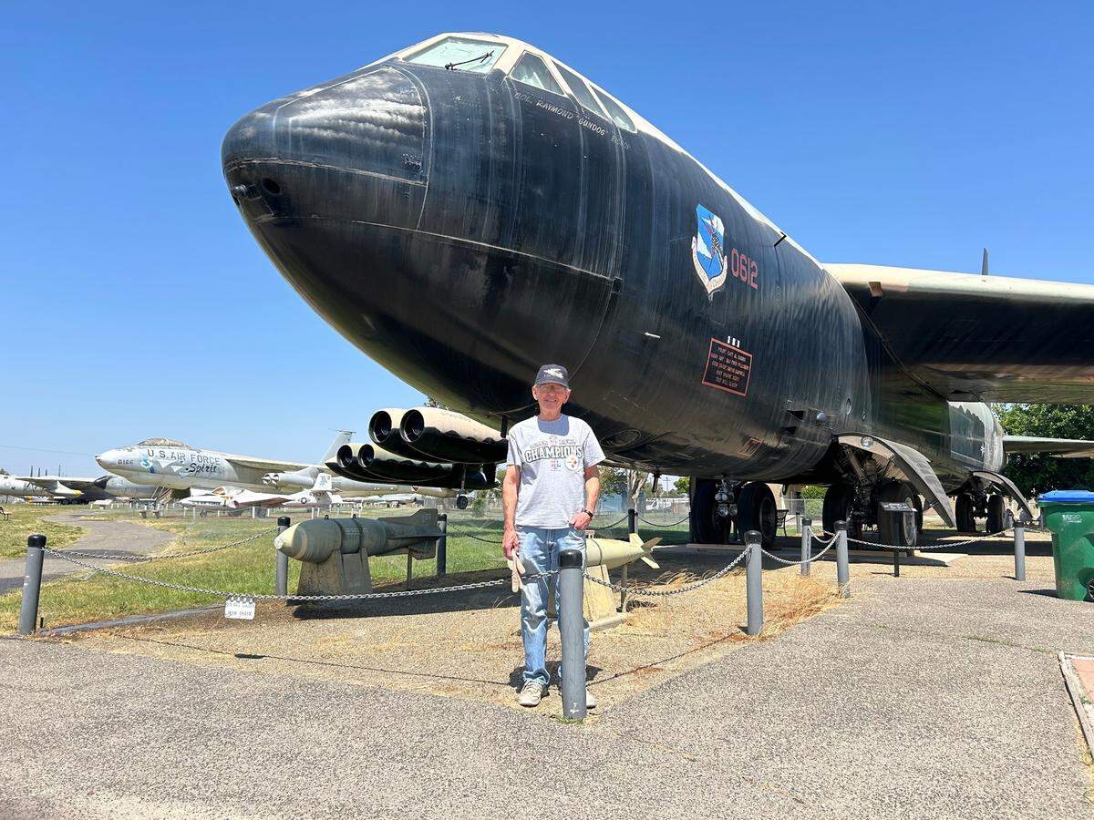 Alvin Osborn, a volunteer at Castle Air Museum, stands near a Boeing B-52D Stratofortress Strategic Bomber. Osborn served in the Air Force for 26 years.