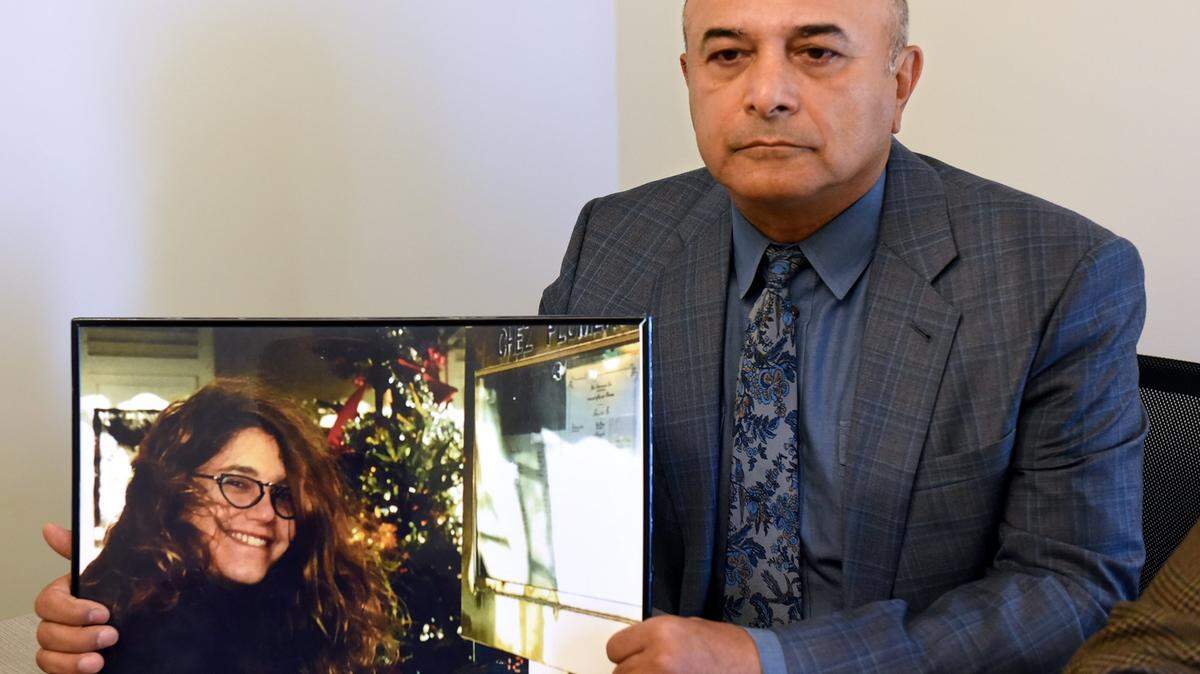 Widower Hanibal Yadegar holds a picture of his wife Evin Olsen Yadegar on Monday morning Sept. 17, 2018 at the conclusion of a court hearing for Stanislaus county sheriff’s deputy Justin Wall in San Joaquin Superior Court. The deputy is accused of voluntary manslaughter in the shooting death of the Modesto woman during a pursuit in Ripon, California.