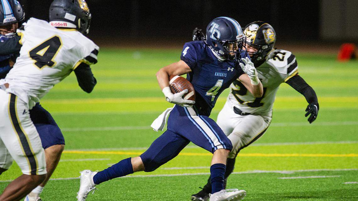Downey’s Michael Nevarez runs the ball during the Central California Athletic League game at Downey High School in Modesto, Calif., on Friday, March 26, 2021. Encohs won the game 20-14.
