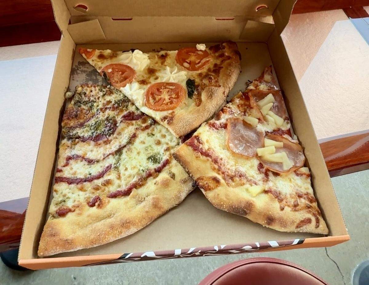 From left, slices of pesto, Manresa and Maui wowie from Pizza My Heart in Tracy, Calif.