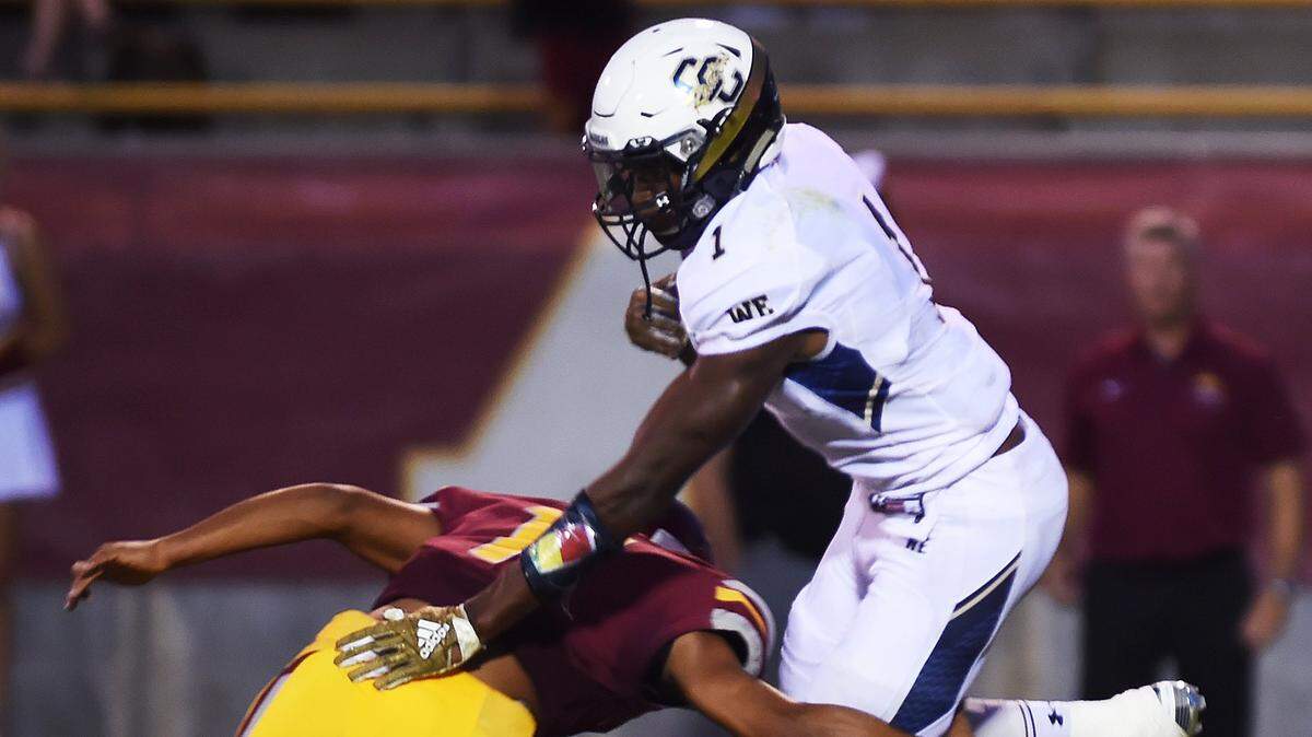 Central Catholic’s Dawaiian Mcneely, right, runs for some of his 145 yards agianst Clovis West on Friday, Aug. 18, 2018. Central Catholic beat Clovis West 21-0 and plays De La Salle on Friday.