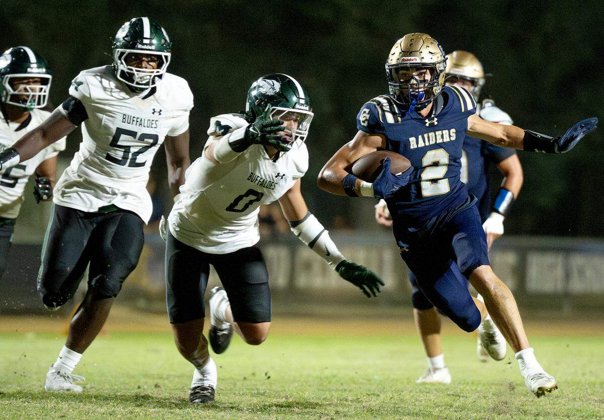 Central Catholic’s Chase Perino runs the ball during the Valley Oak League game with Manteca at Central Catholic High School in Modesto on Friday, Sept. 26, 2025.