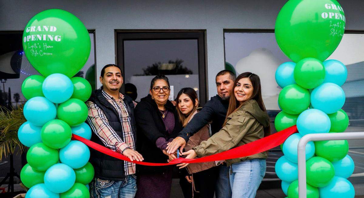 Members of the Gonzalez family celebrate the grand opening of Lupita’s Home Style Cocina Dec. 19, 2021. From L-R: Edgar Gonzalez, Lupita Gonzalez, MaryJo Gonzalez, Saul Gonzalez and Andrea Gonzalez.