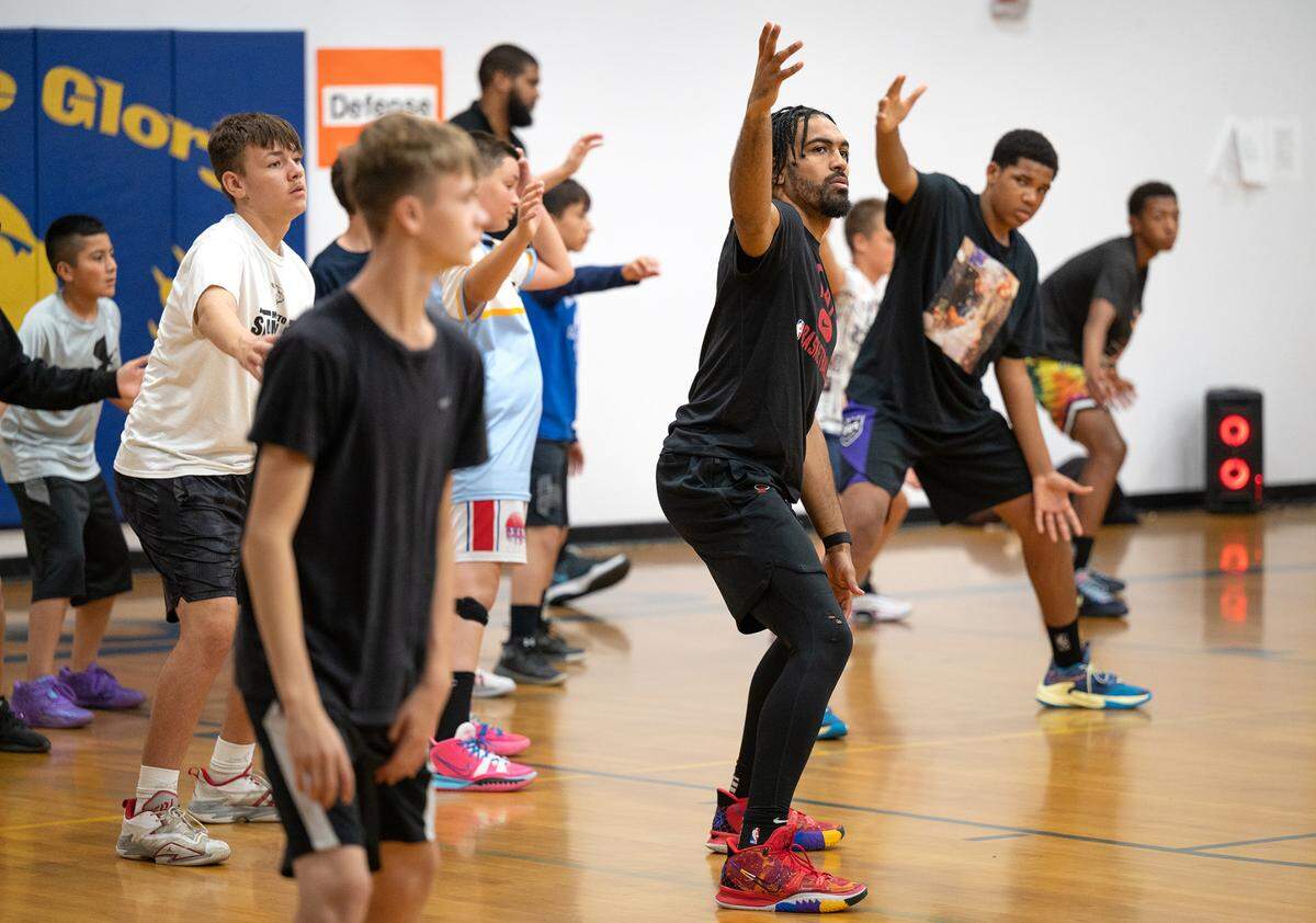Modesto native and NBA player Gabe Vincent works with kids on a defensive drill during the Modesto Slam-N-Jam basketball camp at Big Valley Christian in Modesto, Calif., on Tuesday, July 5, 2022.