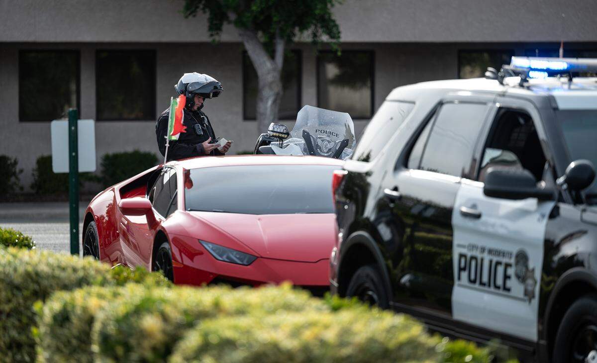 Modesto Police officer Randy Raduechel cites a driver for speeding on McHenry Avenue in Modesto, Calif., on Thursday, May 5, 2022. The California Office of Traffic Safety ranked Modesto worst among its peer cities for traffic crashes. The ranking is for 2019, which is the latest year for which OTS has statistics, and places Modesto first among 59 California cities with 100,000 to 250,000 residents. Modesto’s population is about 220,000 residents.