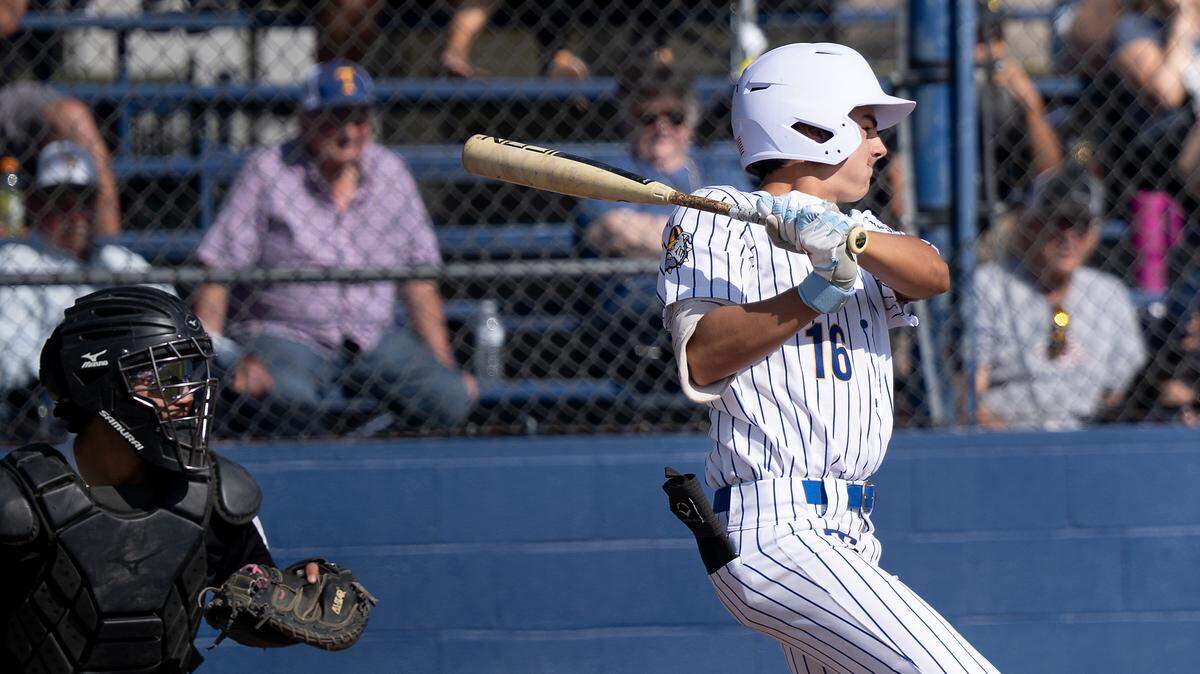 Turlock’s Mason Hackler bats in a runner during the Central California Athletic League game with Pitman at Turlock High School in Turlock, Monday, April 14, 2025.